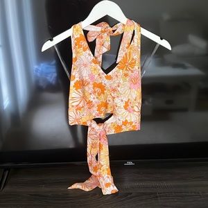 Never worn, cropped floral halter top, with wrap around tie back